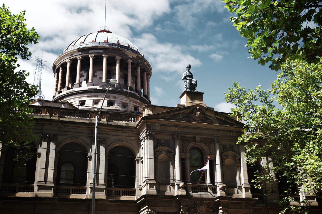 A majestic building with a towering clock, showcasing architectural grandeur.