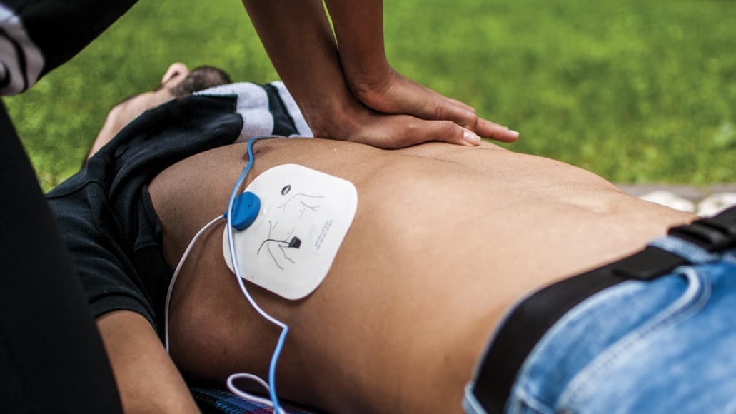 Male body with AED and resuscitation