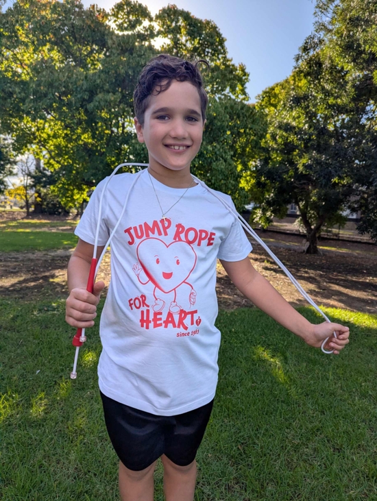 A young boy wearing a Jump Rope for Heart t-shirt