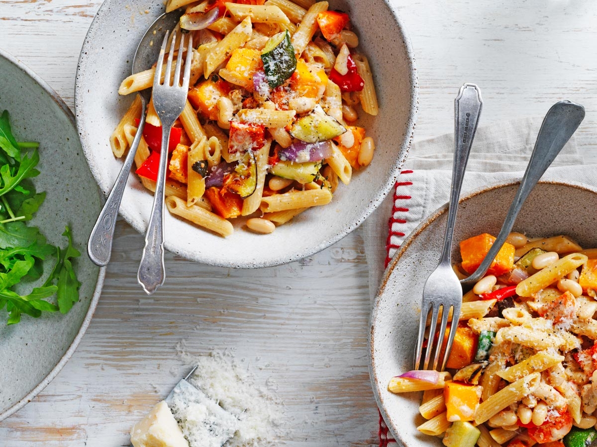 Penne pasta with roasted vegetables, beans and cheese