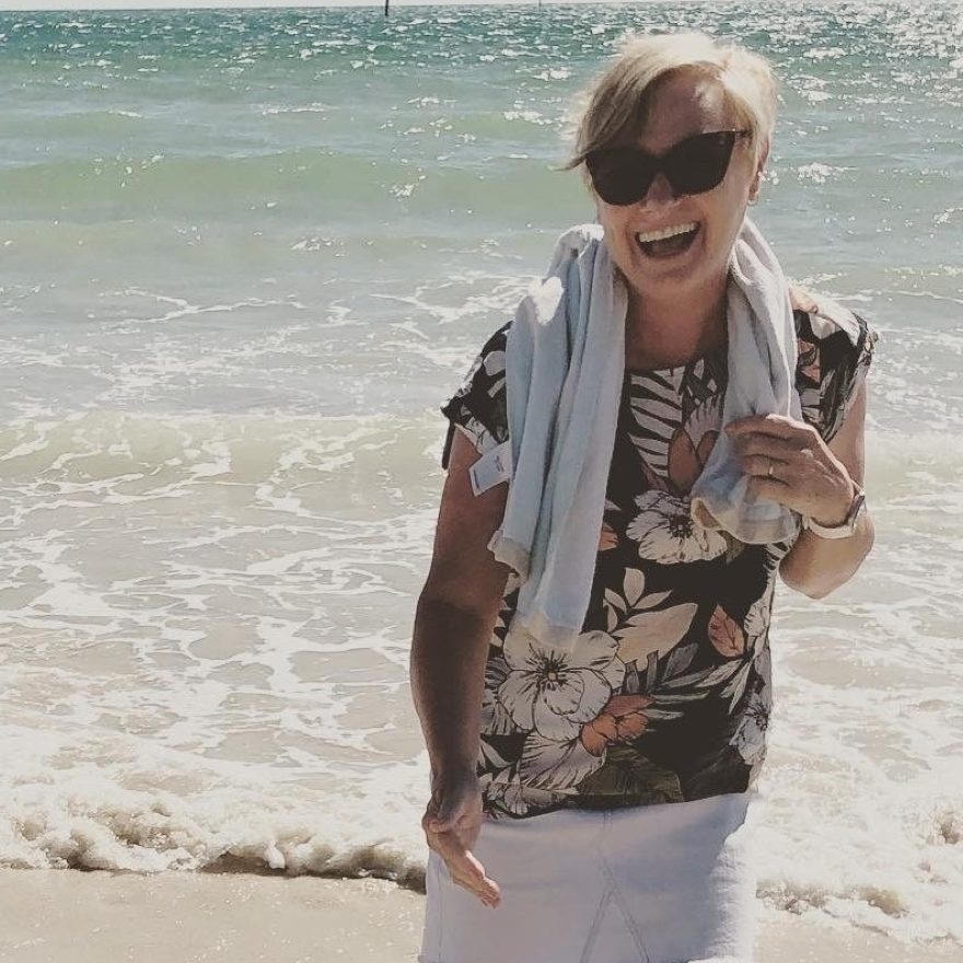 Wendy smiling at the beach